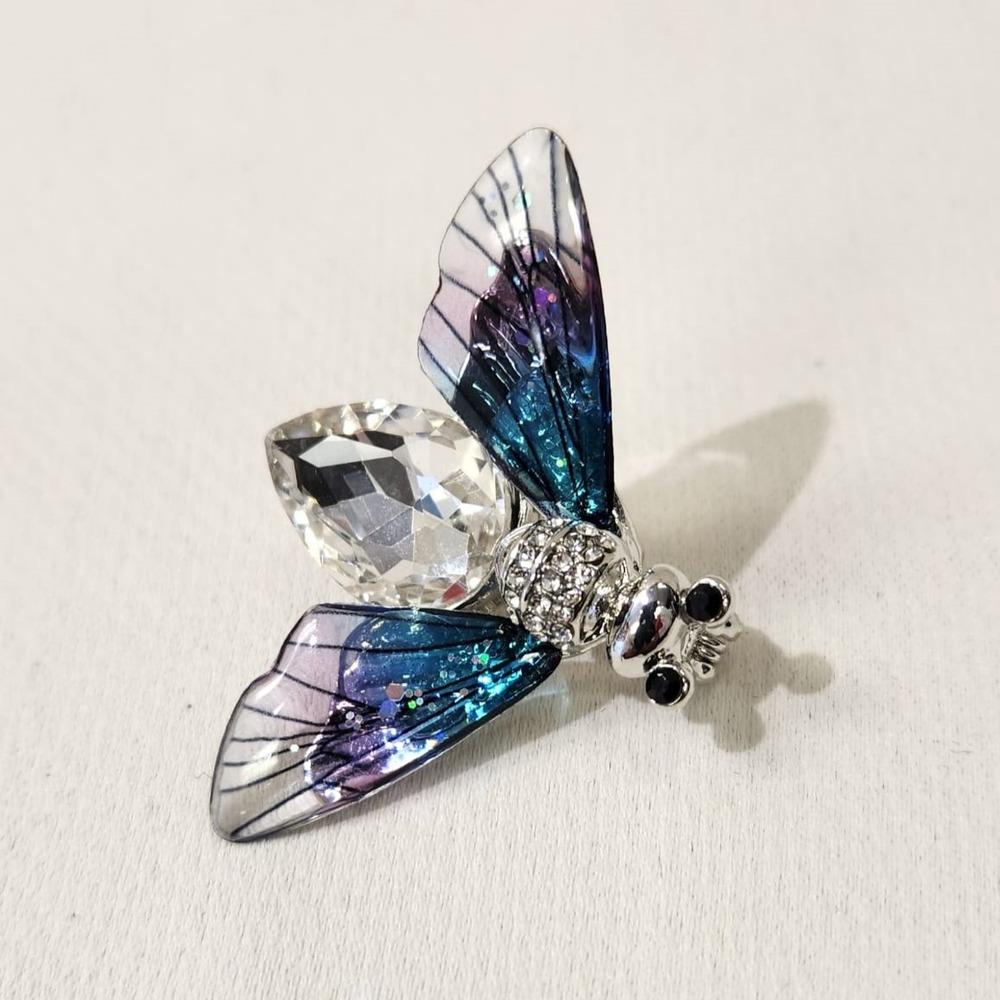 Delicate bee shaped brooch in silver color frame