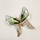 Front view of Butterfly shaped brooch with resin and metal wings