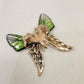 Rear view of Butterfly shaped brooch with resin and metal wings