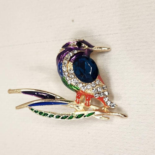 Colorful bird on a branch brooch