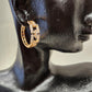 Mid size hoop earrings with loop chain design detail