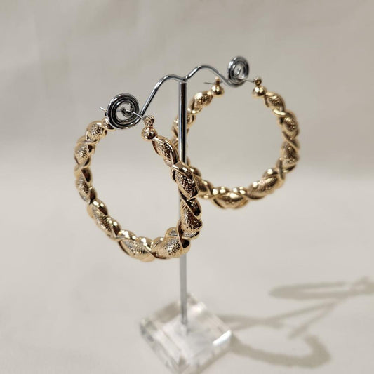 Bold gold colored hoop earrings 
