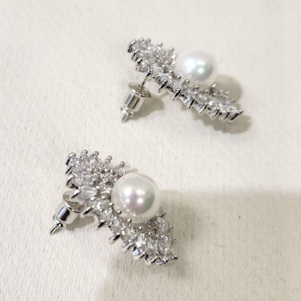 Pushback post of pearl and stone set silver color earrings