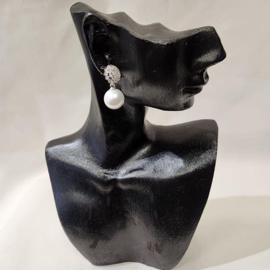 Delicate earrings with stones and dangling pearl