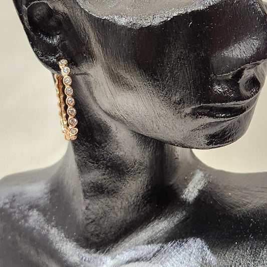 Delicate gold hoops with bezel fit clear stone