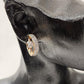 Detailed front view of Small gold hoop earrings with stones