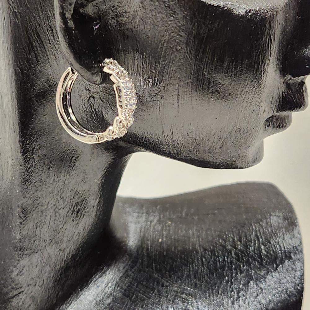 Side view of Small silver frame hoop earrings with stones