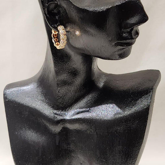 Gold ribbed huggie hoop earrings with stones