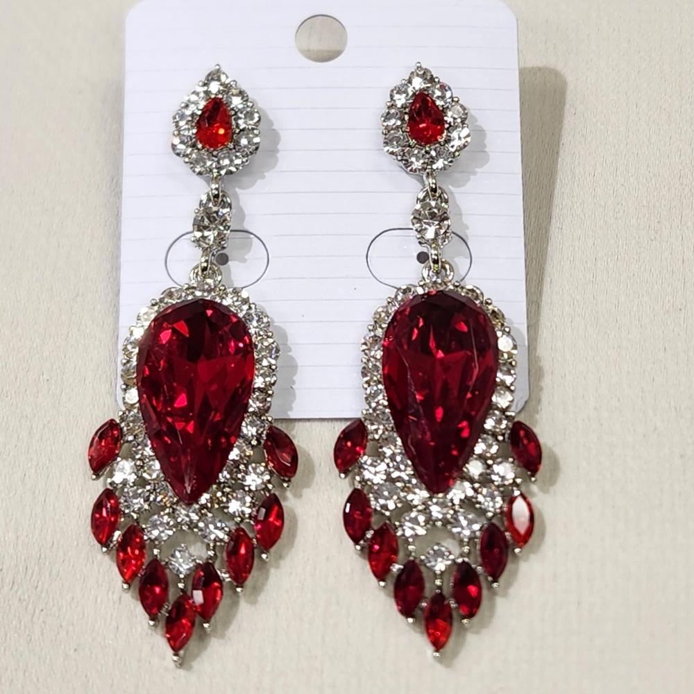 Another view of Silver frame dangle earrings with clear and red stones