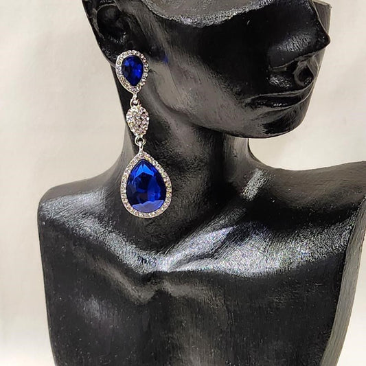 Silver frame dangle earrings with clear and blue stones