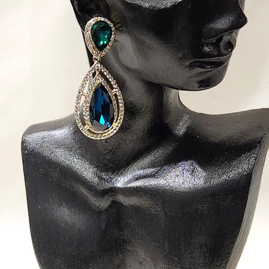 Gold frame dangle earrings with clear and green stones