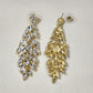 Pushback post of Gold frame dangle earrings with clear stones