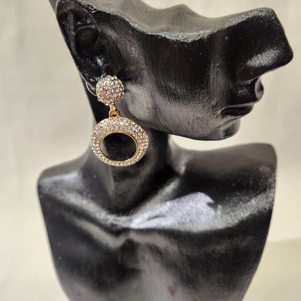 Gold hued stone studded bold dangle earrings