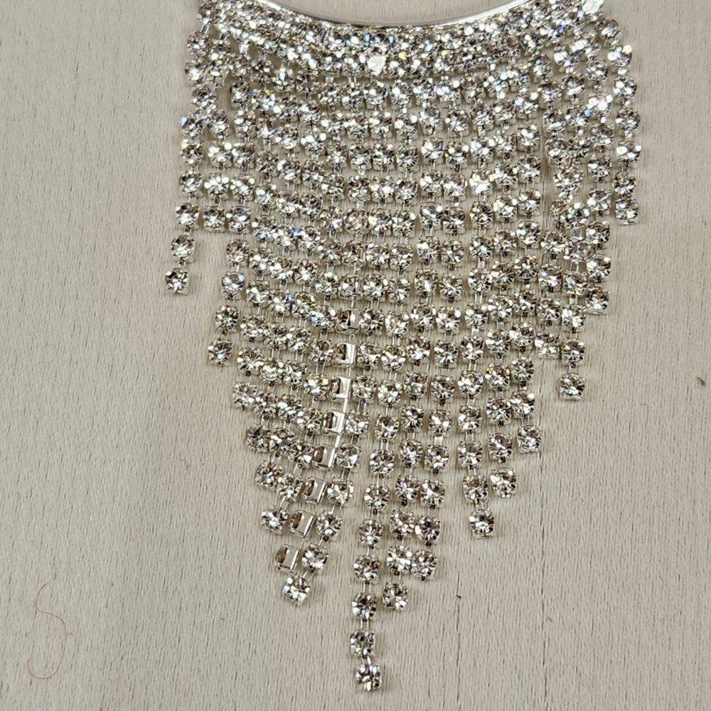 Detailed view of stone studded dangling strings