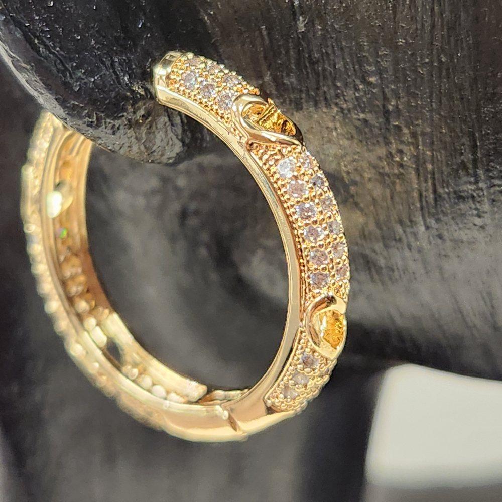 Another side view of gold hoop earrings