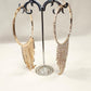 Another view of Gold frame stone studded large hoops