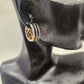Detailed view of Multirow gold earrings with clear and black stone