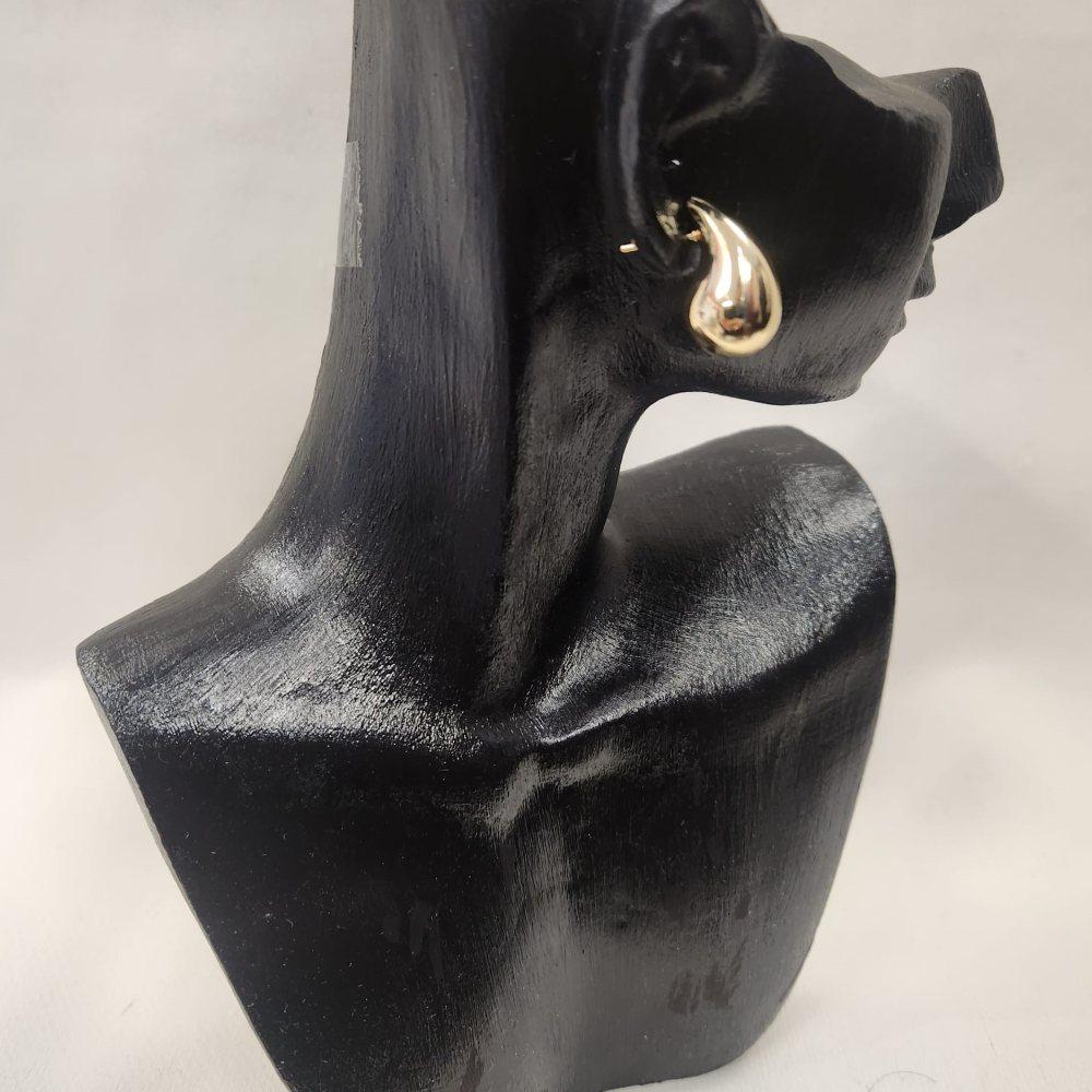 Side view of Tear drop shaped gold earrings