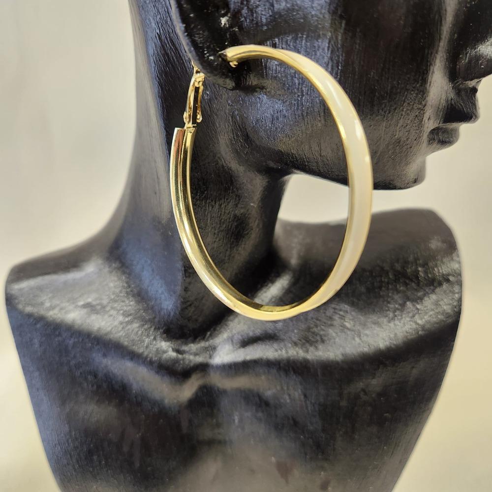 Detailed view of Large hoop earrings with white enamel coating