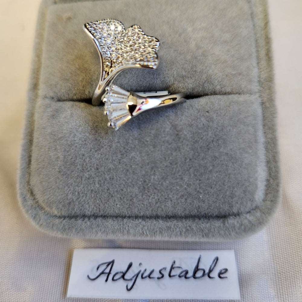 Detailed view of Adjustable leaf shaped silver colored ring