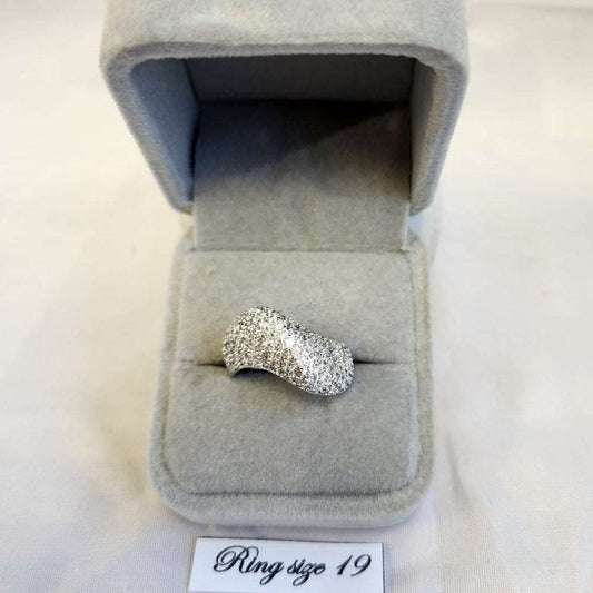 Curved ribbon shaped stone studded ring