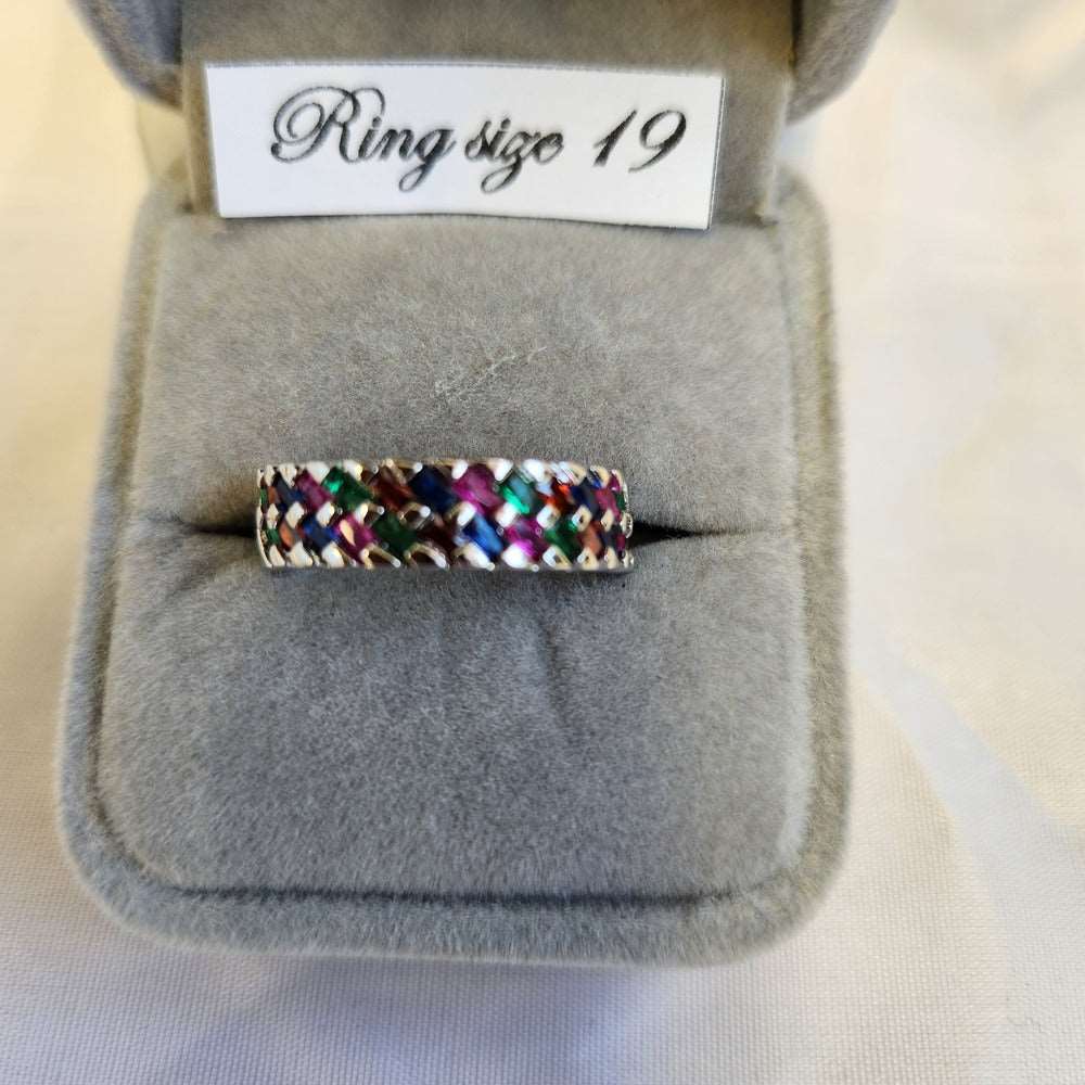 Detailed view of Basket weave ring band with multi colored stones