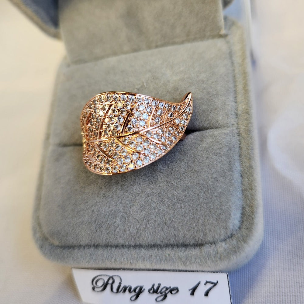 Detailed view of Rose gold leaf shaped stone studded ring