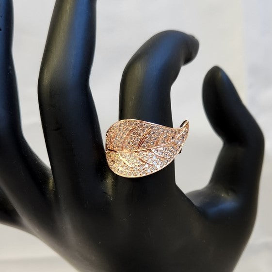 Alternative view of rose gold leaf shaped ring on mannequin stand