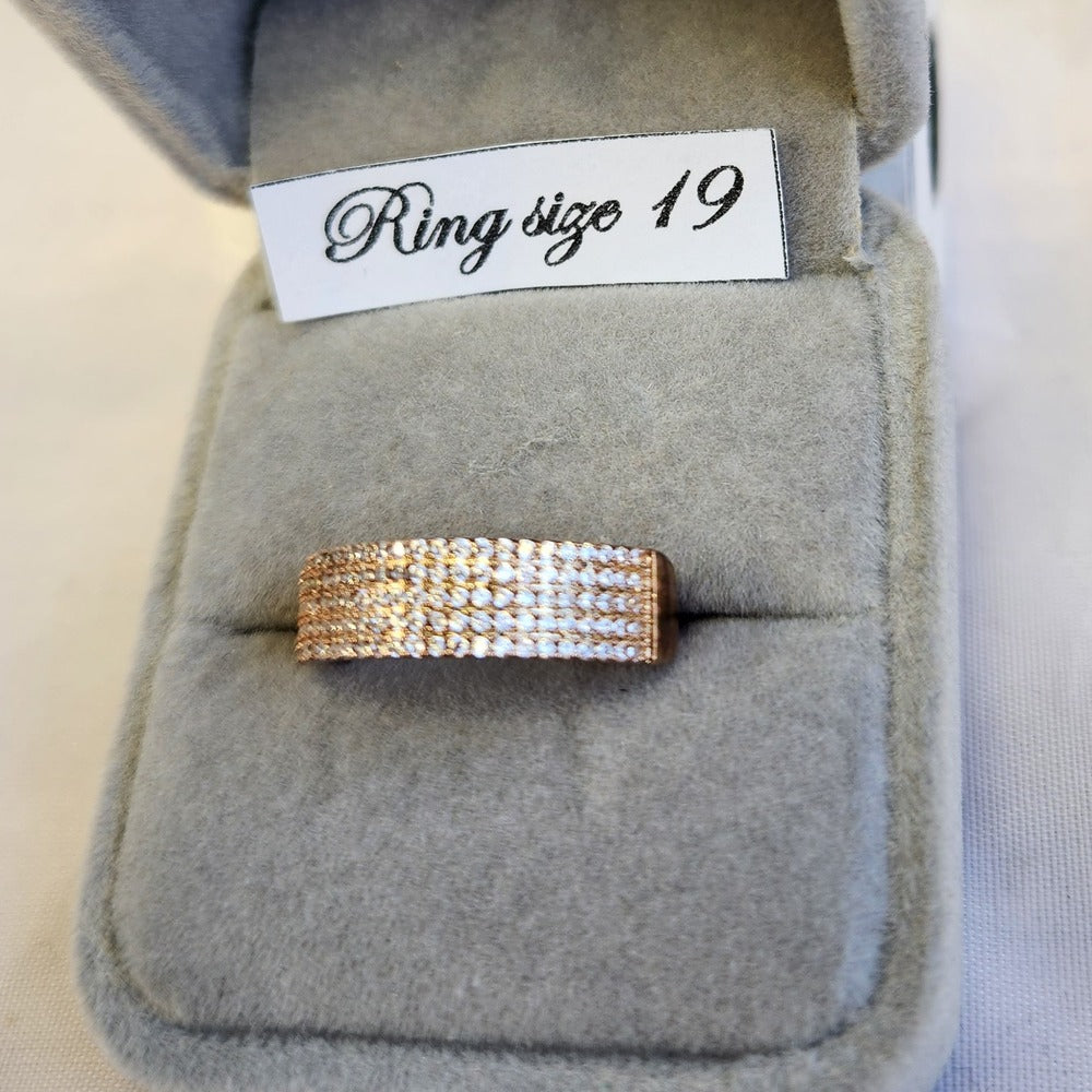 Detailed view of Rose gold ring band with rows of finely set stones
