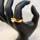 Alternative view on mannequin stand of gold color prong set ring