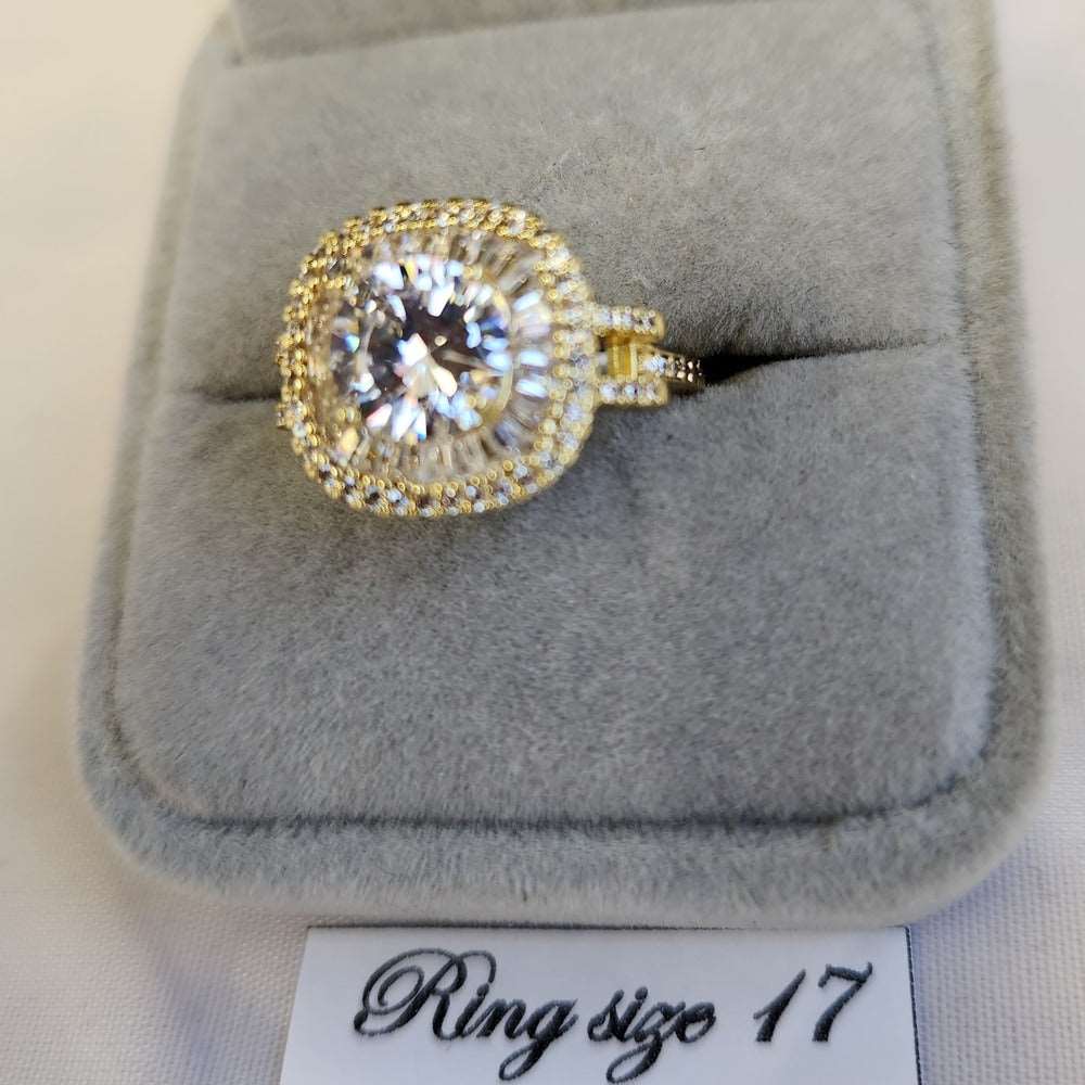 Detailed view of cushion set gold color stone studded ring