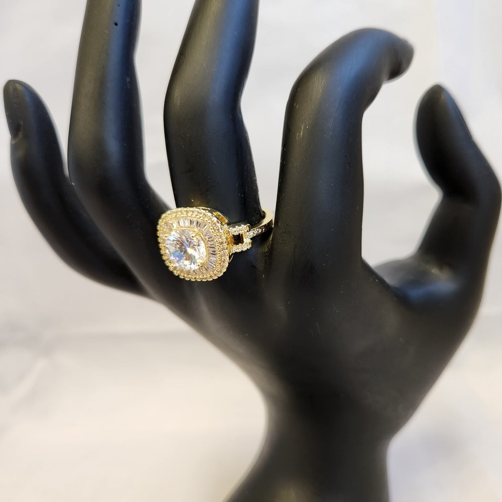 Alternative view of cushion set gold color ring on mannequin stand