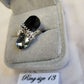 Detailed view of Bold silver color ring with black and grey stones