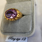 Detailed view gypsy style gold color ring with lavender center stone