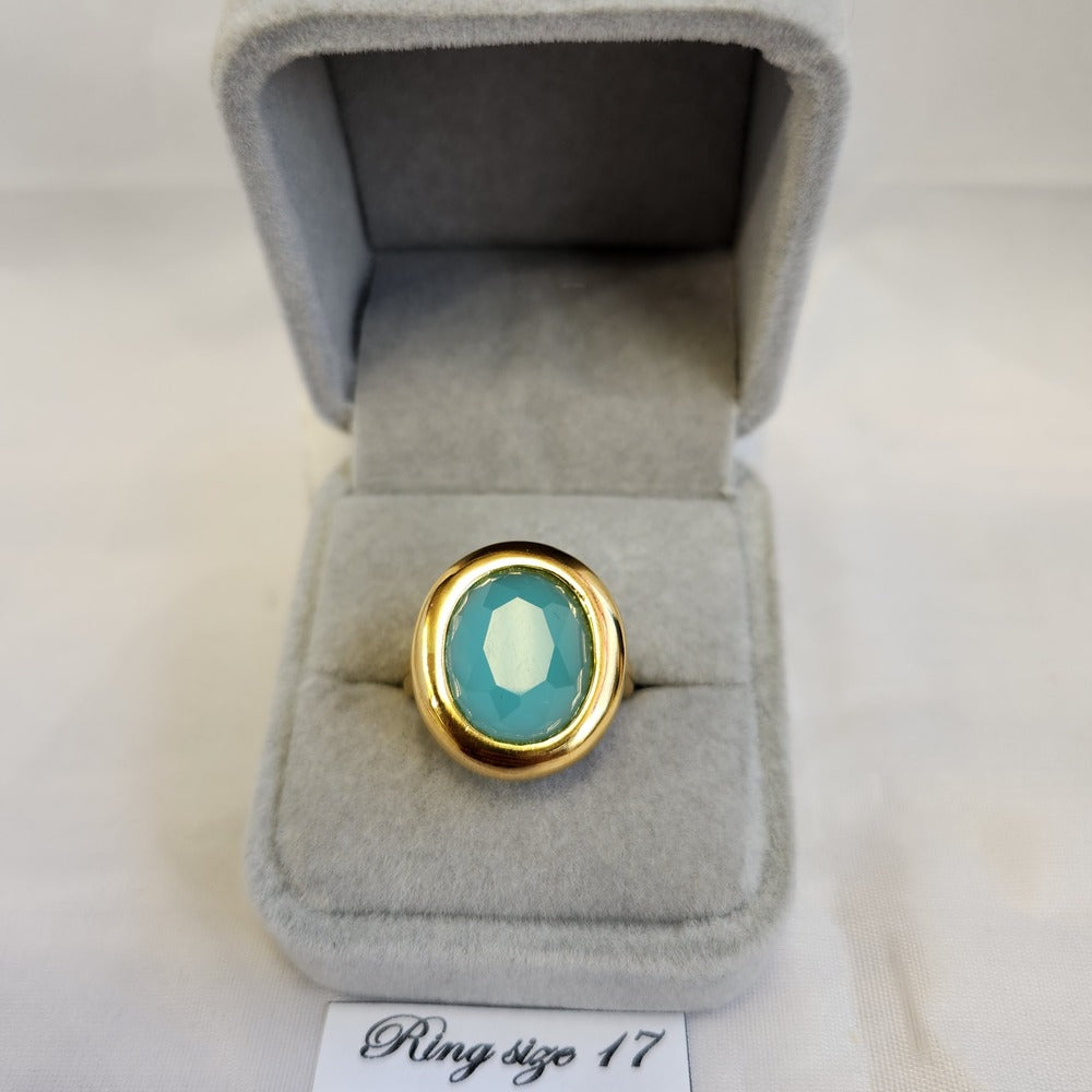 Bold gold frame ring with oval turquoise center stone