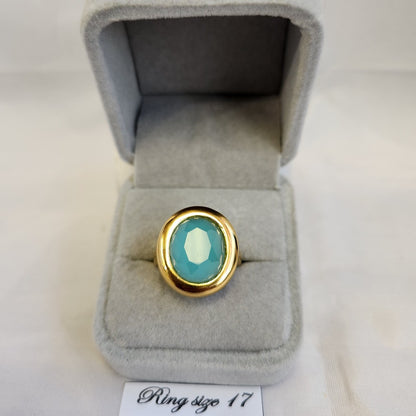 Bold gold frame ring with oval turquoise center stone