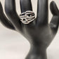 Detailed front view of Multi strand modern silver hued colored ring