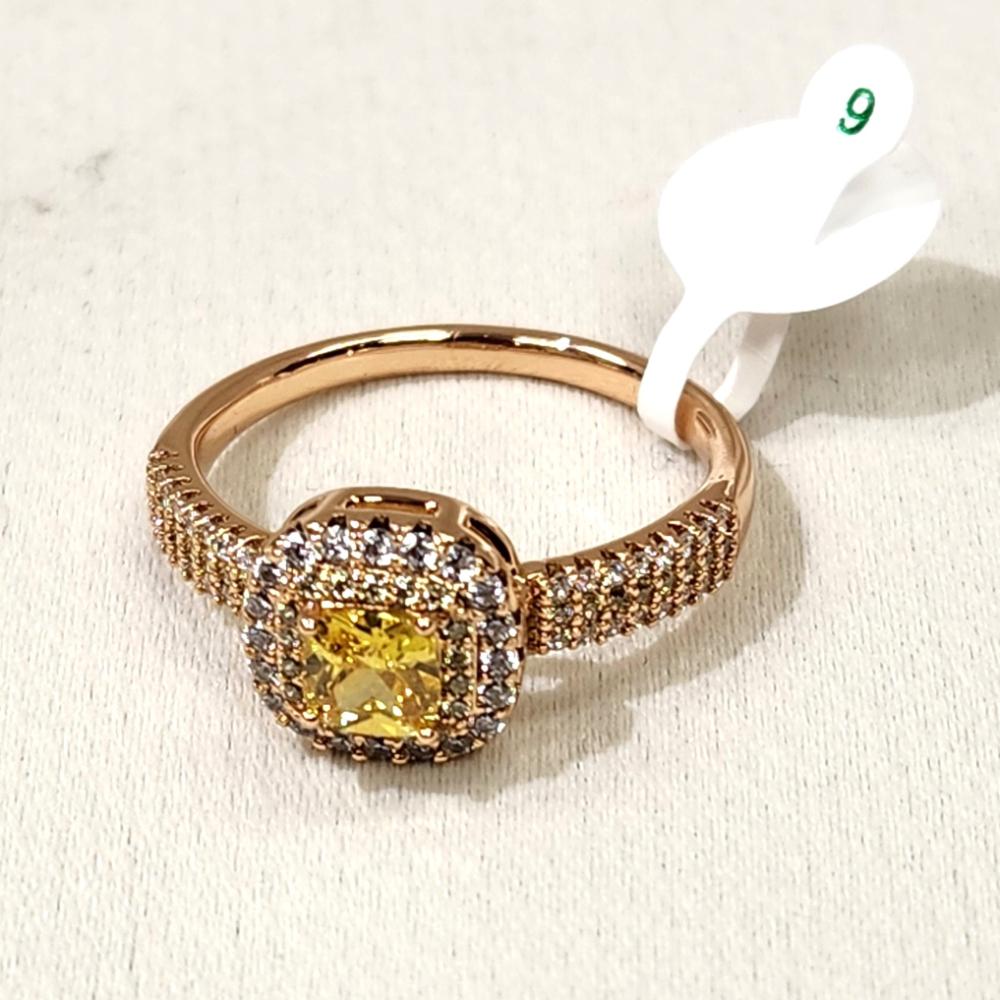 Another view of Gold color ring with square shaped yellow center stone