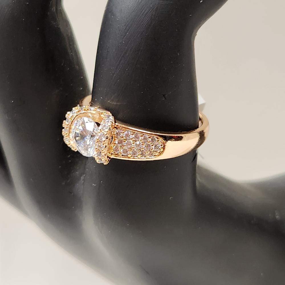 Side view of Exquisite gold color ring with round center stone 