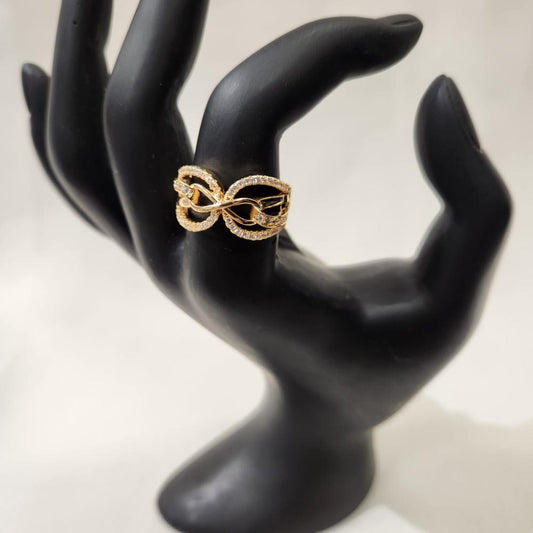 Infinity gold hued ring with cubic zirconia