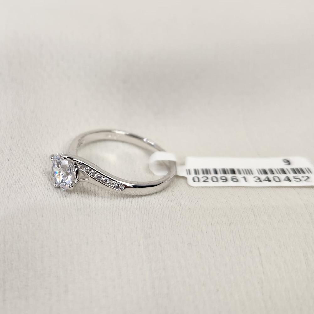 Another view of Solitaire style ring with stone studded shoulder