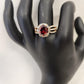 Beautiful gold frame ring with oval red center stone