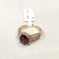 Beautiful gold frame ring with oval red center stone