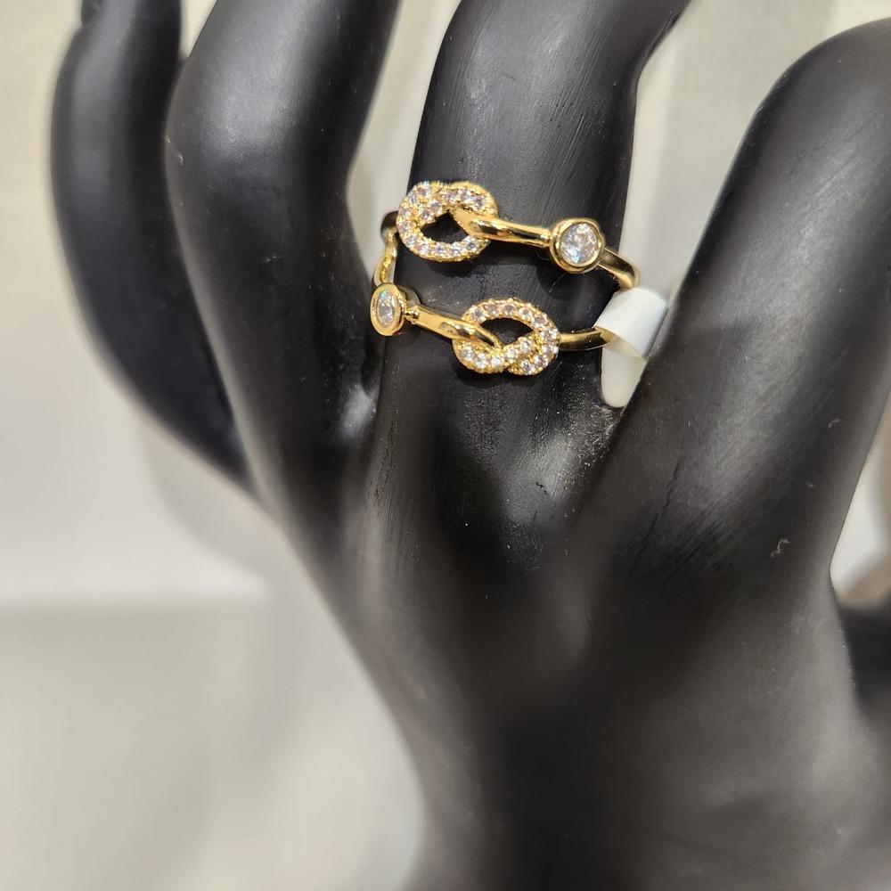 Detailed view of Double strand gold knot ring with cubic zirconia