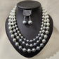 Jewelry set with triple strand pearl necklace in color gradation