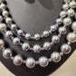 Grey white color graded triple strand pearl necklace 