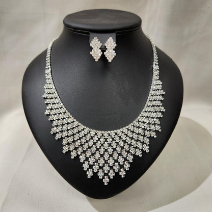Full view of silver tone three piece jewelry set