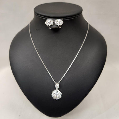 Three piece silver tone jewelry set with clear stones
