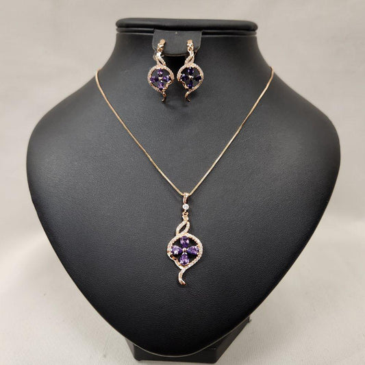 Three piece jewelry set with clear and purple stones