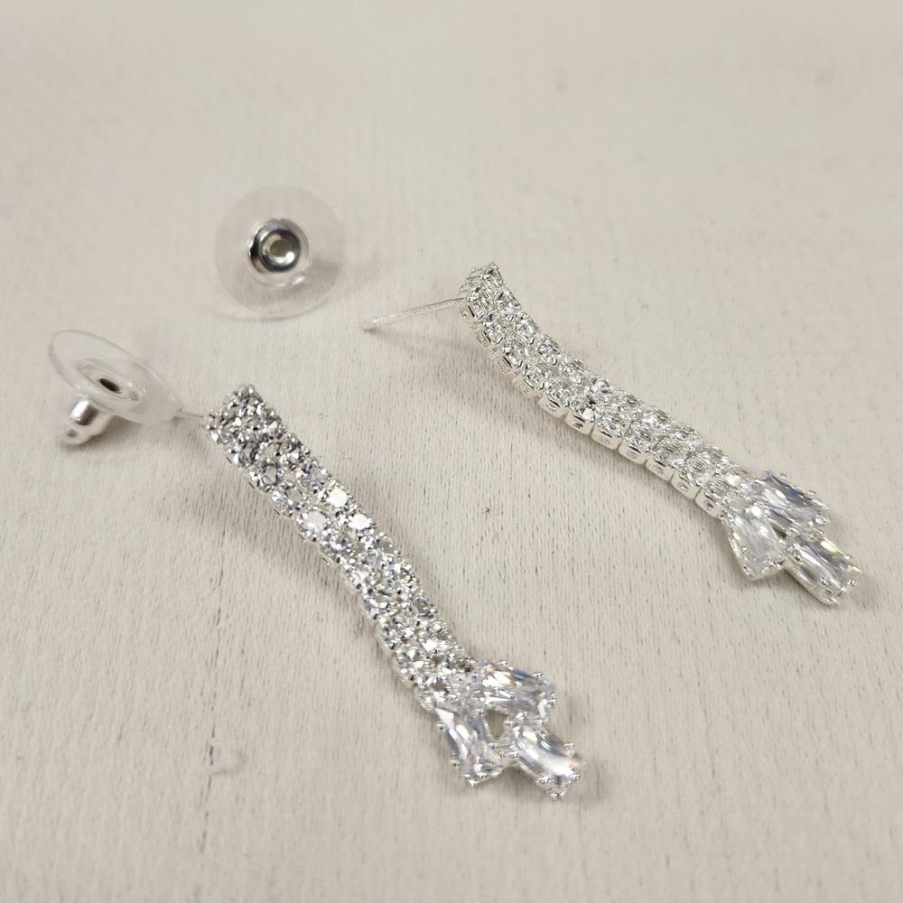 Detailed view of dangle earrings with pushback post